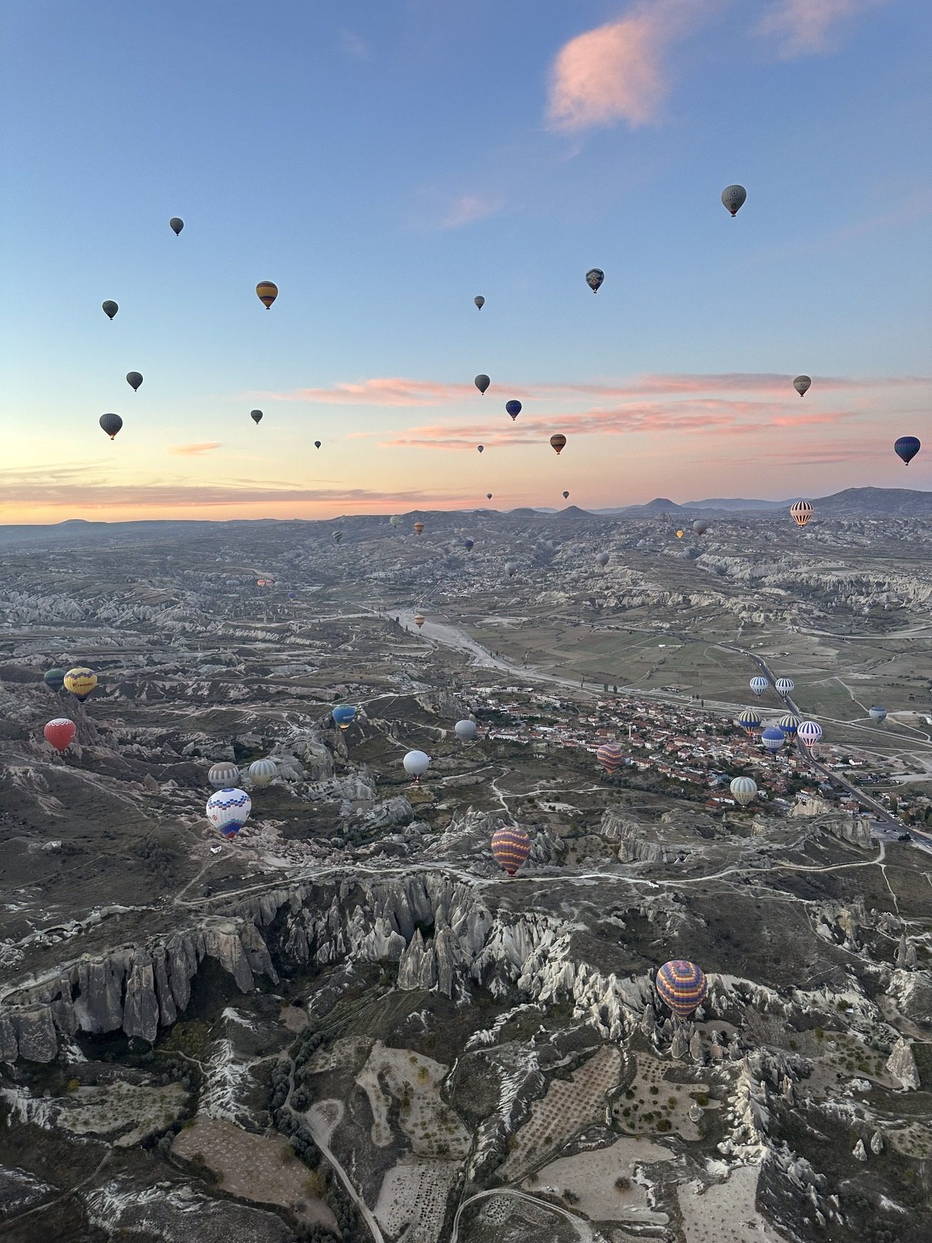 Hot air balloons rising over a landscape at sunrise. The kind of view a remote-first role can put on your calendar.